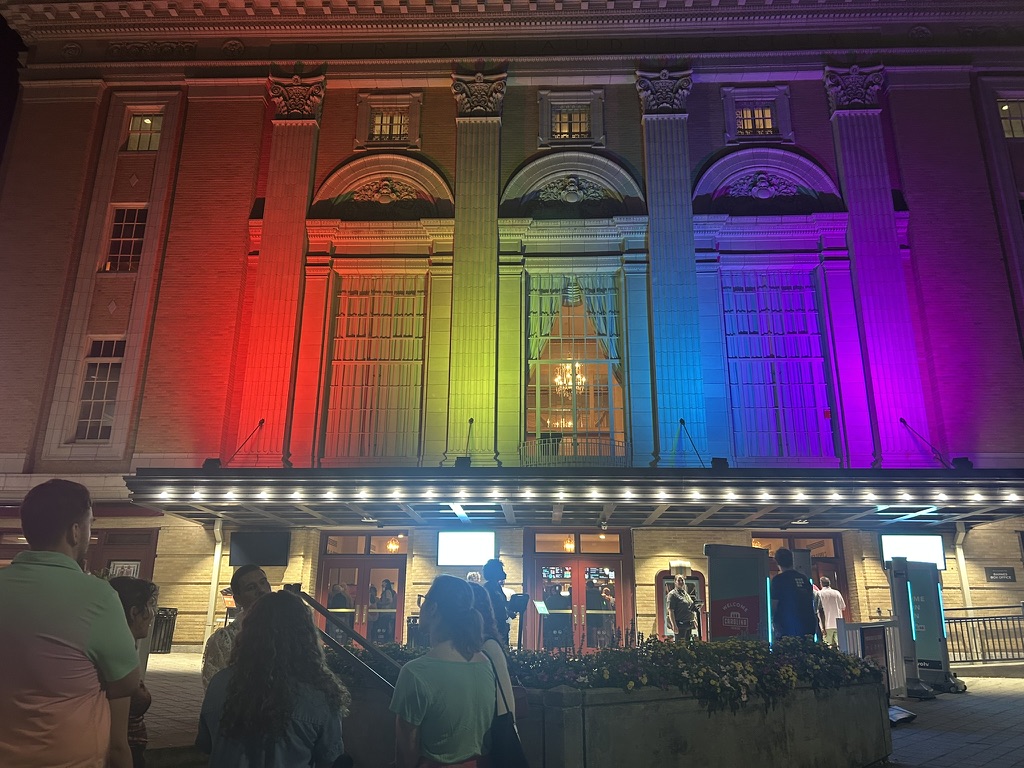 The Carolina Theatre illuminated in rainbow colors for OutSouth Queer Film Festival