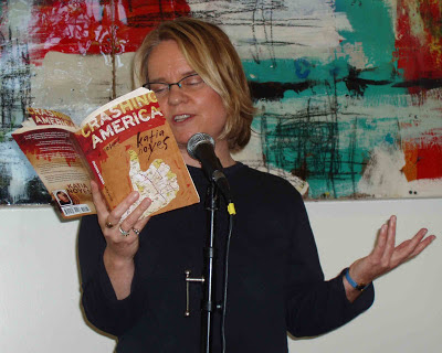 Katia Noyes reading from Crashing America at a microphone